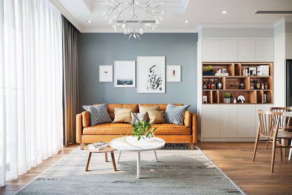 Giấy dán tường màu xám xanh kết hợp các bức tranh decor tạo nên sự hiện đại cho phòng khách. Tập hợp các mẫu bày trí phòng khách đẹp tiện nghi